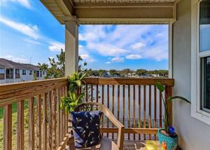 a porch with a chair and a view of the ocean at The Elizabeth in Jacksonville