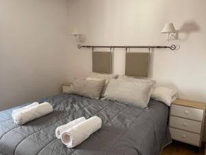 A bed or beds in a room at Casa Vacacional Alcazabilla