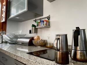 A kitchen or kitchenette at Casa Vacacional Alcazabilla