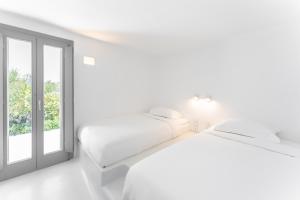 Posteľ alebo postele v izbe v ubytovaní Philosophia Luxury Villa