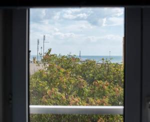 a view of the beach from a window at Stamatina's Luxury Apartments (Central 3rd floor) in Alexandroupoli