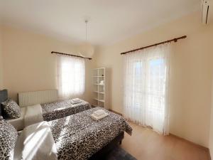 A bed or beds in a room at Leonidio Apartment Maria