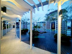 a hallway of a building with a view of therium at Aishah Homestay L19 Troika Kota Bharu in Kota Bharu