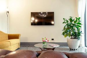 a living room with a couch and a table at Luxury Loft near Duomo and Garage in Milan