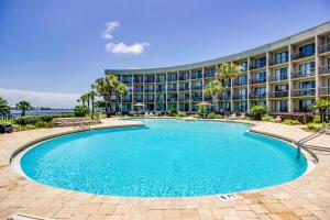 a swimming pool in front of a hotel at Pirates Bay B109 in Fort Walton Beach