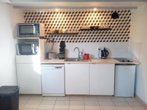 Kuchyň nebo kuchyňský kout v ubytování Gîte Les Cerisiers