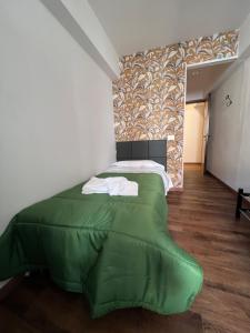 A bed or beds in a room at Hotel Brenta