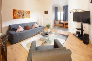 TV a/nebo společenská místnost v ubytování Villa Marie Wohnung 2, Norderney