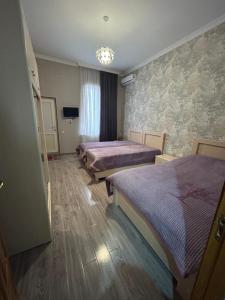 Postel nebo postele na pokoji v ubytování Medea Guest House