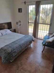 Una cama o camas en una habitación de Casa en Sierras del Mar