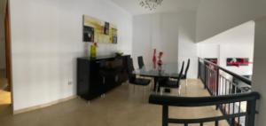 a dining room with a table and chairs at Palm mar Relax House in Palm-Mar