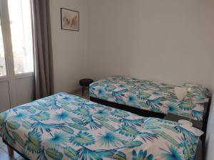 Кровать или кровати в номере F3 moderne proche marché et mer