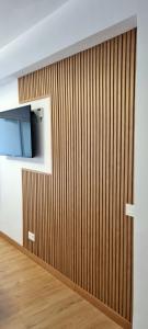 a wood paneled wall in a room at Apartment Puerto Marina - First Line Beach - Benalmadena - Málaga in Benalmádena