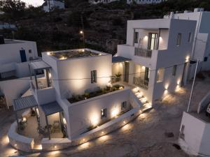 an aerial view of a white building with lights at Azure Kimolos in Kimolos