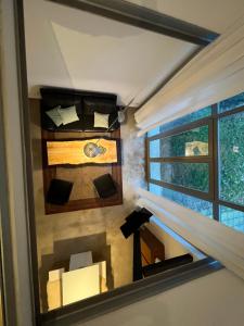 an attic room with a bed and a window at Historisches Designer Loft in Essen