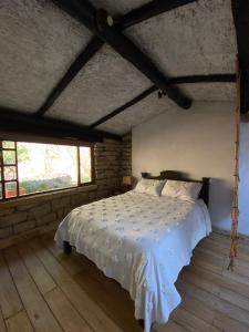 Postel nebo postele na pokoji v ubytování Hotel Rokas de Suesca + 37 fotografií