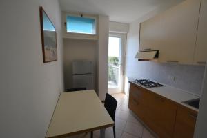 A kitchen or kitchenette at Lignano Pineta with marvellous sea view