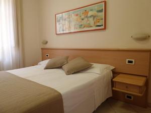 Posteľ alebo postele v izbe v ubytovaní Hotel Astor