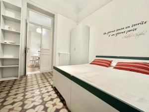 A bed or beds in a room at PALAZZO LA ZAGARA