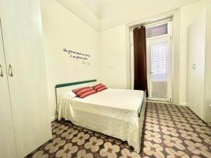 A bed or beds in a room at PALAZZO LA ZAGARA