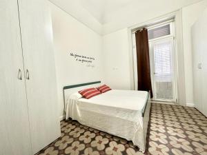 A bed or beds in a room at PALAZZO LA ZAGARA