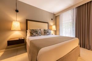 Postel nebo postele na pokoji v ubytování Madisson Boutique Hotel Cartagena