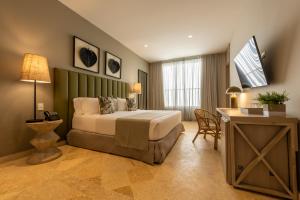 Postel nebo postele na pokoji v ubytování Madisson Boutique Hotel Cartagena