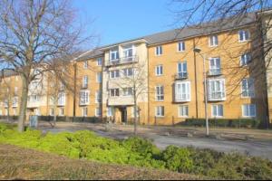 a large brick building in front of a street at 3 bedroom flat 10 mins walk to Bay and City center Free Parking in Cardiff