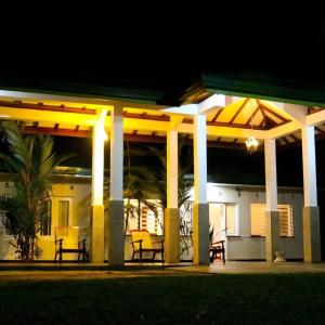 a house with a lit up porch at night at HangarankandaBungalow Deniyaya in Deniyaya