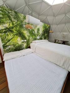 Letto o letti in una camera di Ubuntu Glamping