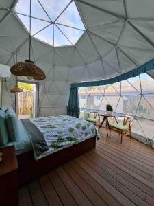 Postel nebo postele na pokoji v ubytování Ubuntu Glamping