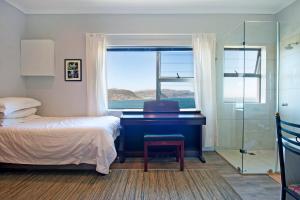 Ένα ή περισσότερα κρεβάτια σε δωμάτιο στο The Captains Penthouse