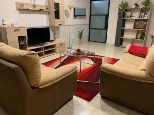 Televízia a/alebo spoločenská miestnosť v ubytovaní Apartamento Completo Regina
