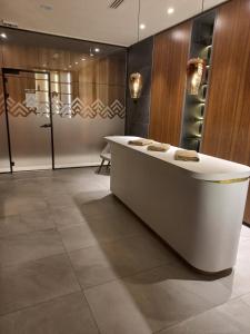 a lobby with a white counter in a room at MR. O Apartments Woodside Kopaonik in Kopaonik