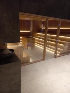 a view of a room with a mirror and a room with at MR. O Apartments Woodside Kopaonik in Kopaonik +14 photos