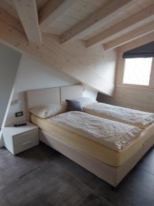 a bedroom with two beds in a attic at Lucas Haus in Livigno