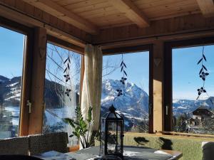 a room with a table with a view of a mountain at Troadkasten Hollnhof in Donnersbach