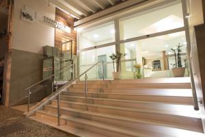 a set of stairs in a building with a window at Casablanca Center Hotel in Petrópolis