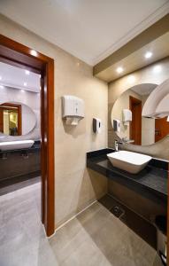 a bathroom with a sink and a mirror at Nile Treasure Cruise - 4 or 7 Nights From Luxor each Saturday and 3 or 7 Nights From Aswan each Wednesday in Luxor