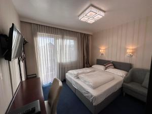 Postel nebo postele na pokoji v ubytování Hotel Austria