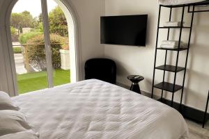 Łóżko lub łóżka w pokoju w obiekcie VILLA LA QUIETUDE