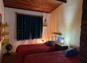 Ένα ή περισσότερα κρεβάτια σε δωμάτιο στο Casa na Montanha-Joanópolis-Próx Ponto de Luz