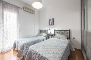 Ένα ή περισσότερα κρεβάτια σε δωμάτιο στο West Athens Studio