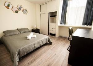מיטה או מיטות בחדר ב-Apartamento Zona Corferias