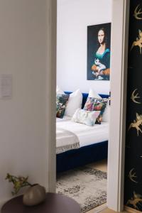 A bed or beds in a room at Design Apartman - Free parking
