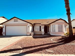 a house with a palm tree in front of it at Glendale Gem with Pool & Office in Prime Location in Glendale