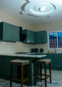 Kuchyň nebo kuchyňský kout v ubytování CORNERSTONE APARTMENTS