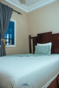 Postel nebo postele na pokoji v ubytování CORNERSTONE APARTMENTS