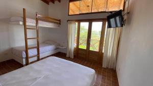 Postel nebo postele na pokoji v ubytování Hotel Casa Vichayo