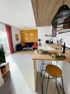 a kitchen and living room with a table and chairs at Mijas Loft in Mijas